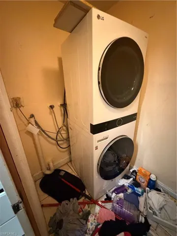 Stacked LG laundry unit featuring a white finish with front-loading circular glass doors