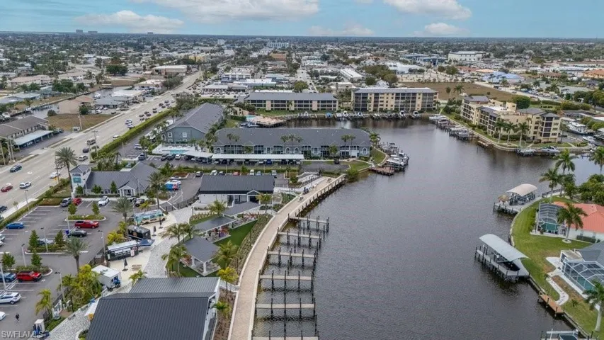 Aerial overview of property's location with a nearby body of water