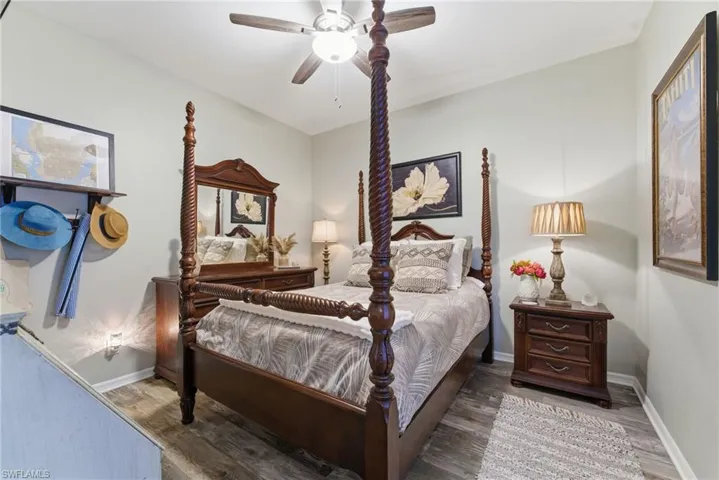 Bedroom featuring ceiling fan and wood finished floors
