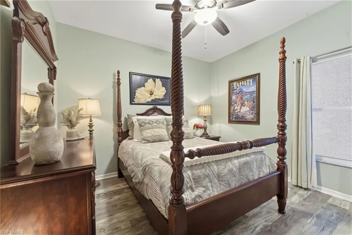 Bedroom featuring wood finished floors and ceiling fan