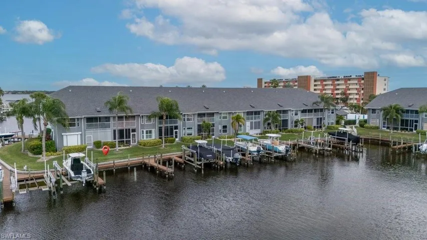 Dock featuring boat lift and a water view