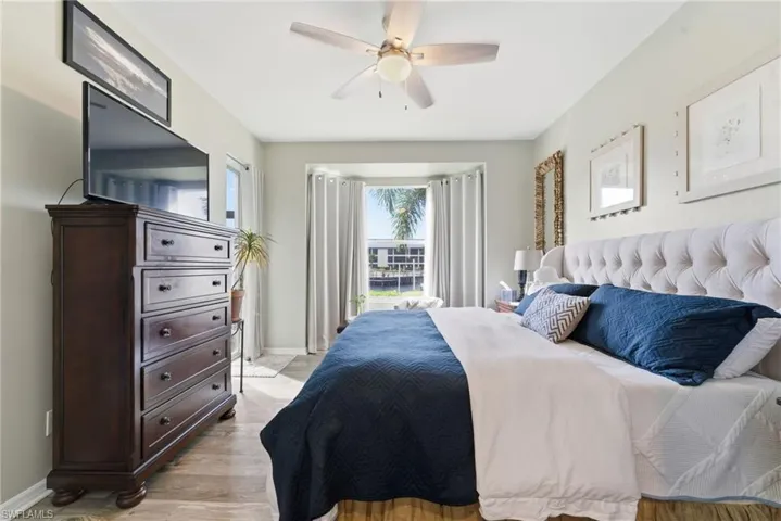 Bedroom with light wood-type flooring and ceiling fan