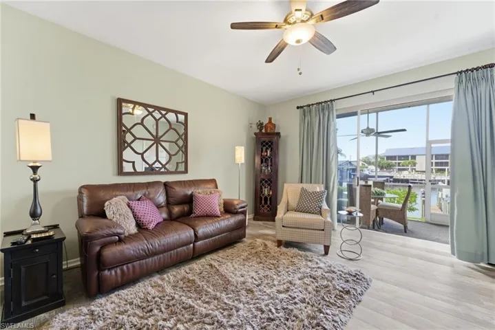 Living room with a ceiling fan and wood finished floors