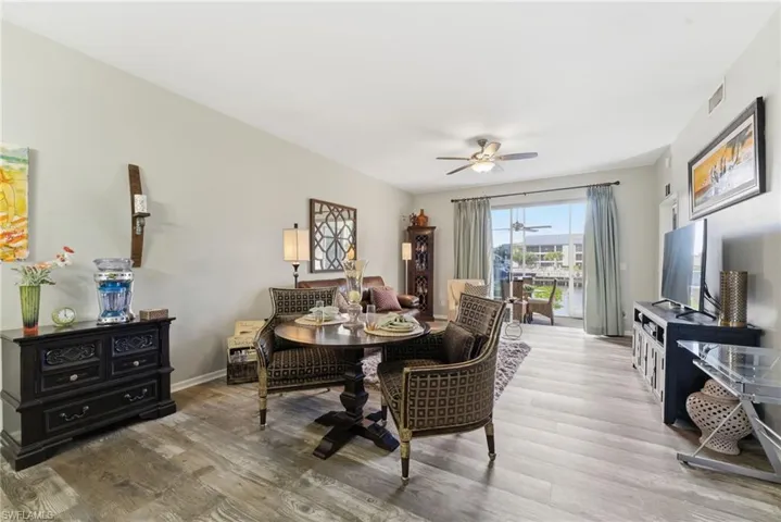 Dining space featuring a ceiling fan and wood finished floors