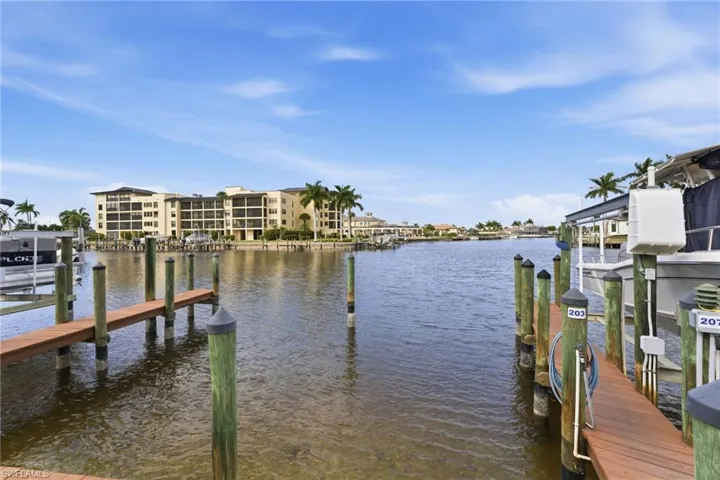 Dock featuring a water view and boat lift