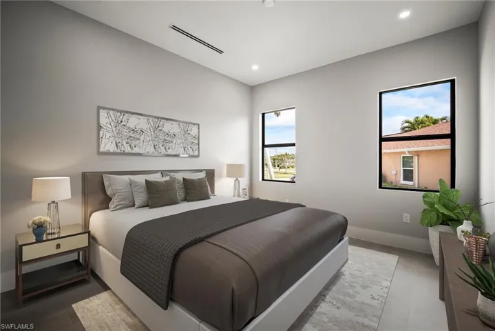 Bedroom with wood finished floors and recessed lighting