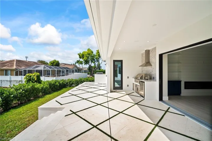 View of patio featuring an outdoor kitchen