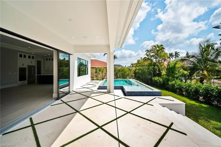 Outdoor pool featuring a patio