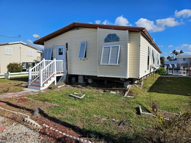 View of front of home with a front lawn