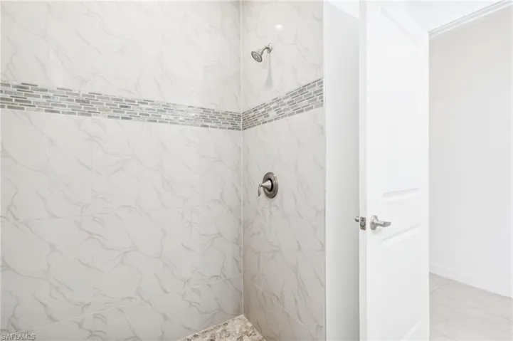 Bathroom with tiled shower
