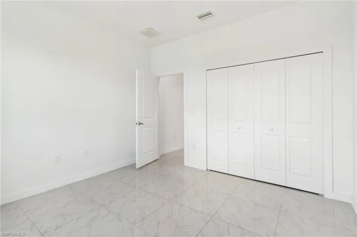 Unfurnished bedroom with a closet