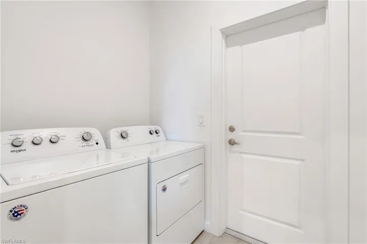 Washroom featuring independent washer and dryer