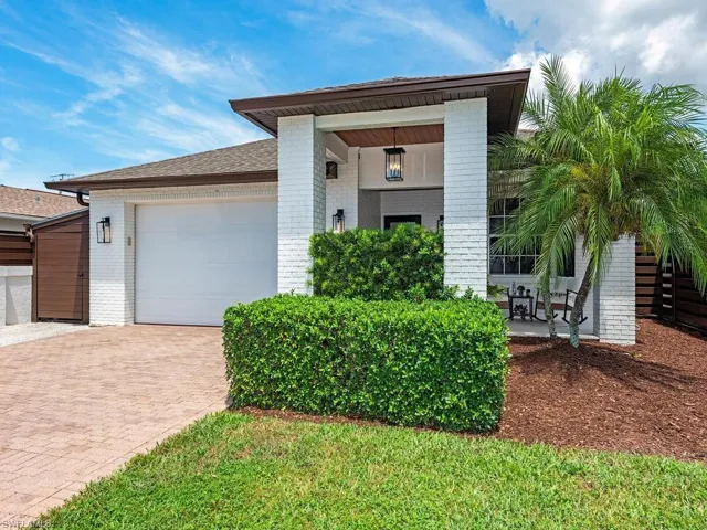 White brick with large covered front porch