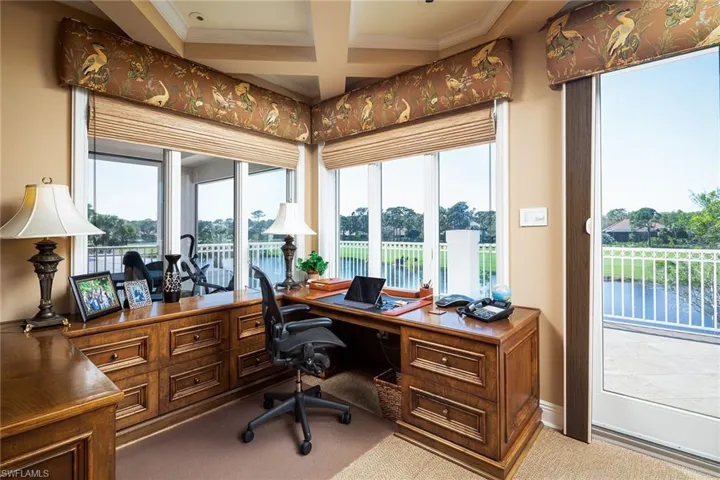 Office with light carpet, coffered ceiling, and ornamental molding