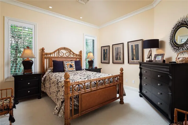 Bedroom featuring crown molding, light carpet, and recessed lighting