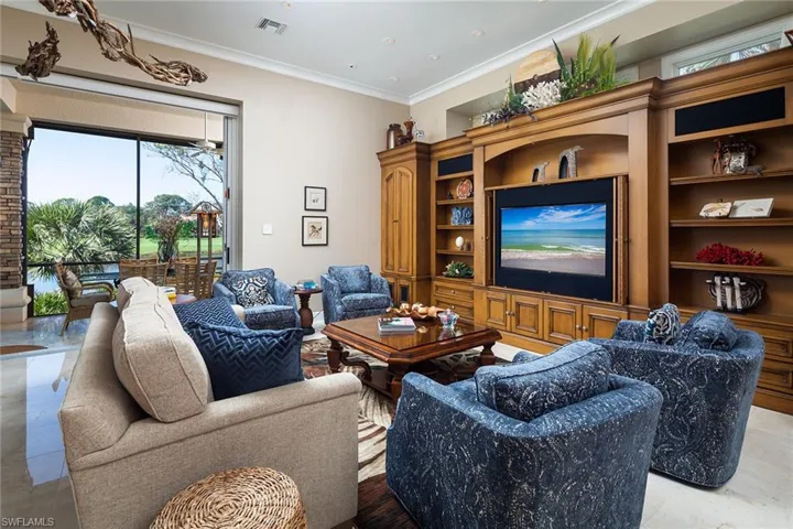 Living area featuring crown molding
