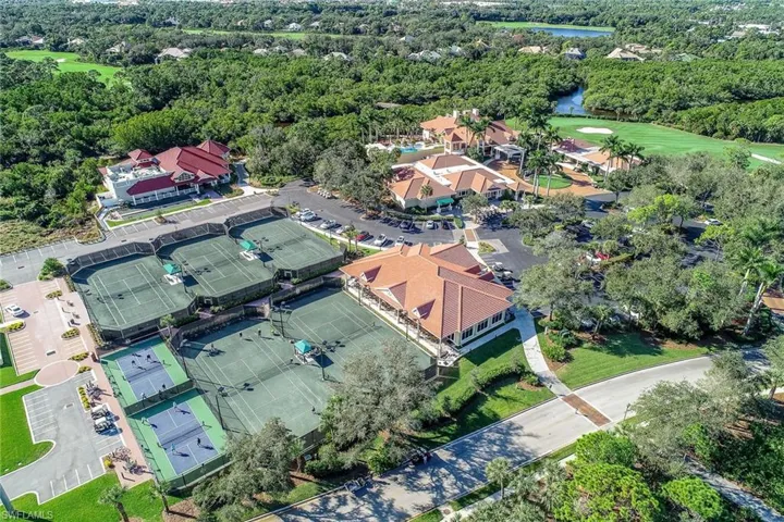 View of property location featuring a nearby body of water and a golf club