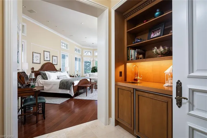 Bedroom featuring ornamental molding, light wood finished floors, and recessed lighting