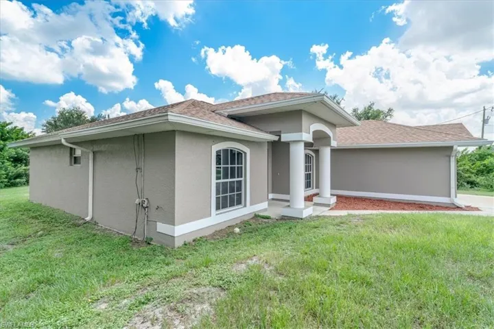 View of front of house with a front lawn