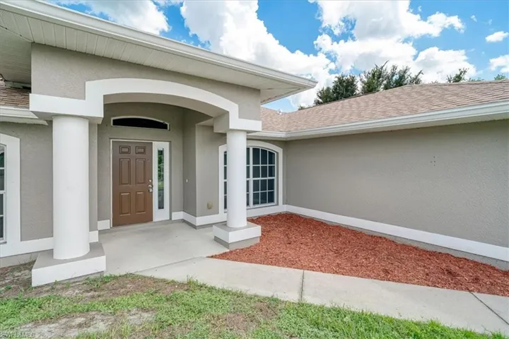 Entrance to property with a porch