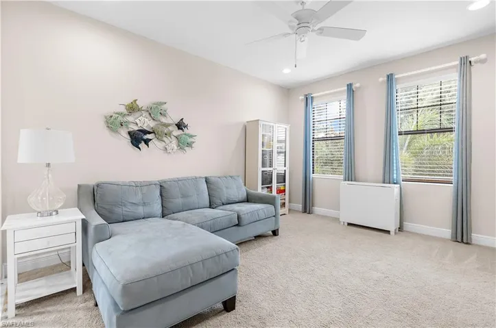 Neutral-toned walls complement plush carpeting