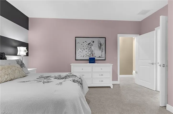 Neutral carpet flooring with light pink wall paint
