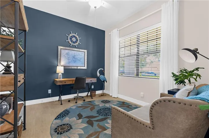 Accent wall in a deep blue hue, complemented by light-toned wall finishes