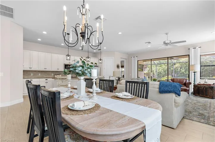 Open-concept living space with light wood-finish flooring throughout