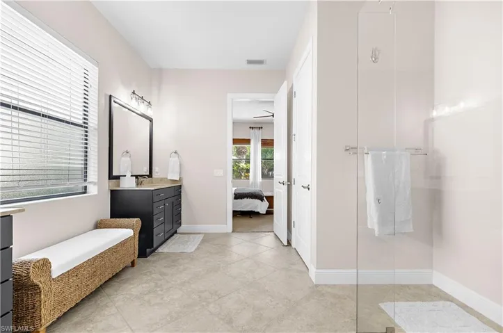 Bathroom featuring neutral wall tones and tile flooring