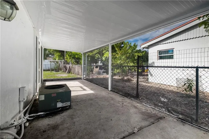 Fenced backyard featuring a patio