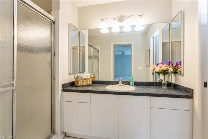 Bathroom with vanity and an enclosed shower