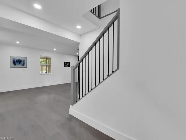 Stairs with dark wood-type flooring