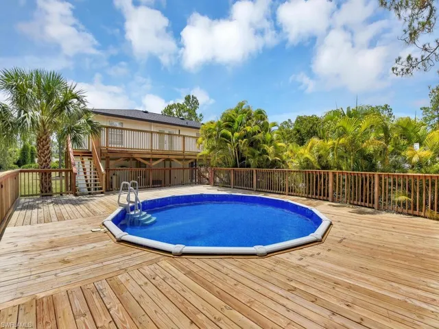 View of swimming pool featuring a deck