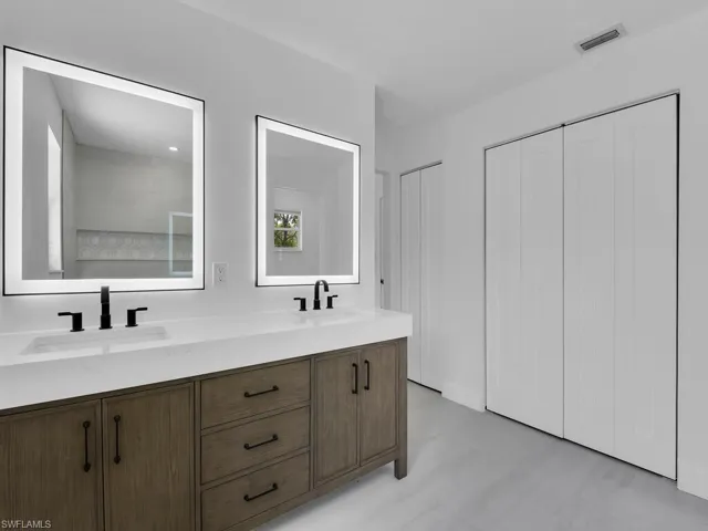 Bathroom with dual bowl vanity