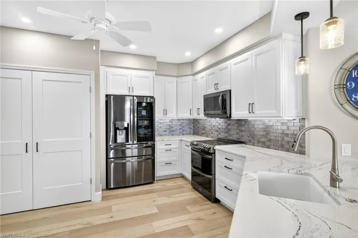LG Printproof dark stainless steel appliances.  Smart InstaView Refrigerator features dual ice makers including specialty slow-melting Craft Ice perfect for your lemonade or cocktail.