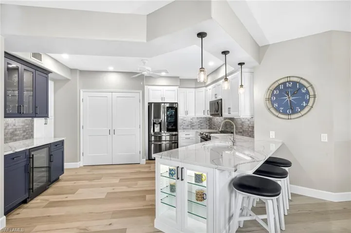 Shaker cabinetry with pull outs, dovetail slow-close drawers, LED pancake lighting
