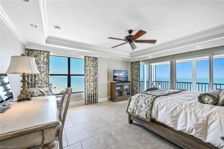 The tasteful decor of the primary suite brings peace while emphasizing the views