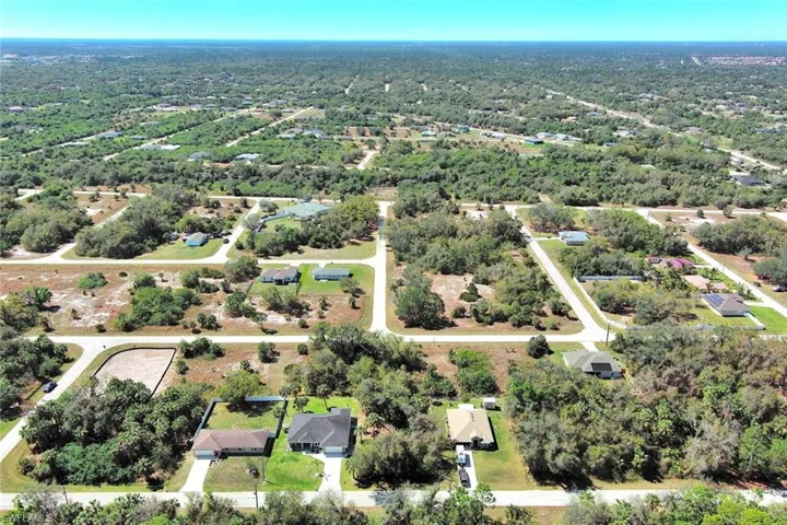 Aerial overview of property's location with nearby suburban area