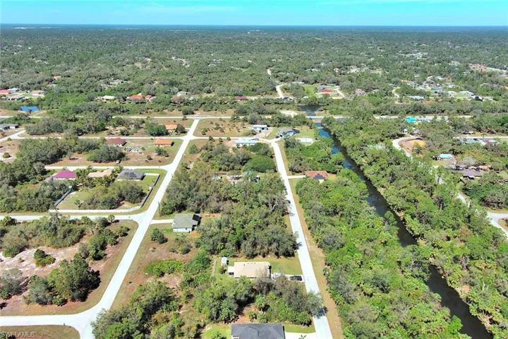 View of property location with nearby suburban area and a large body of water