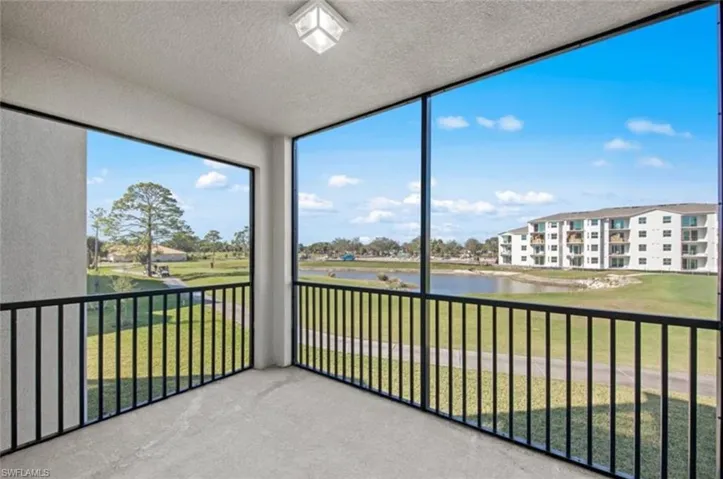 Unfurnished sunroom with a water view
