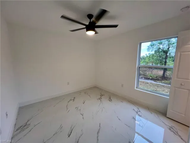 Guest bedroom with ceiling fan.