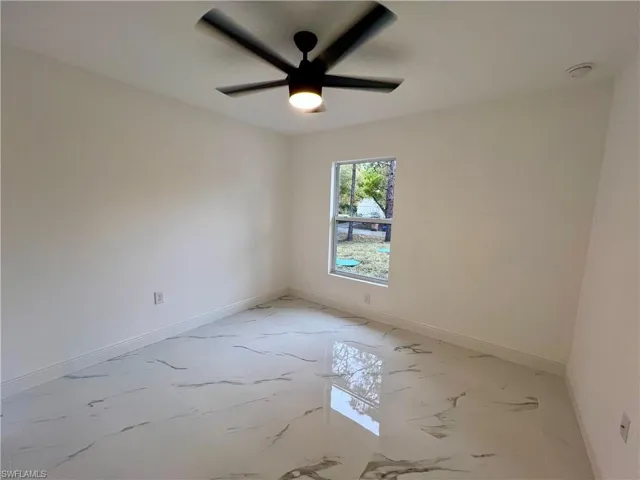 Guest bedroom with ceiling fan.