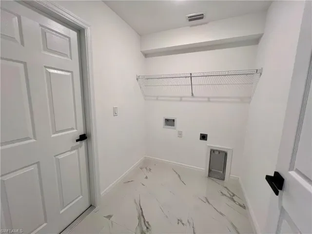 Washroom with washer hookup and hookup for an electric dryer