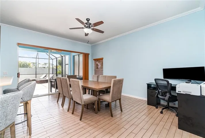 Dining area with a sunroom, crown molding, a ceiling fan, light wood finished floors, and an office area