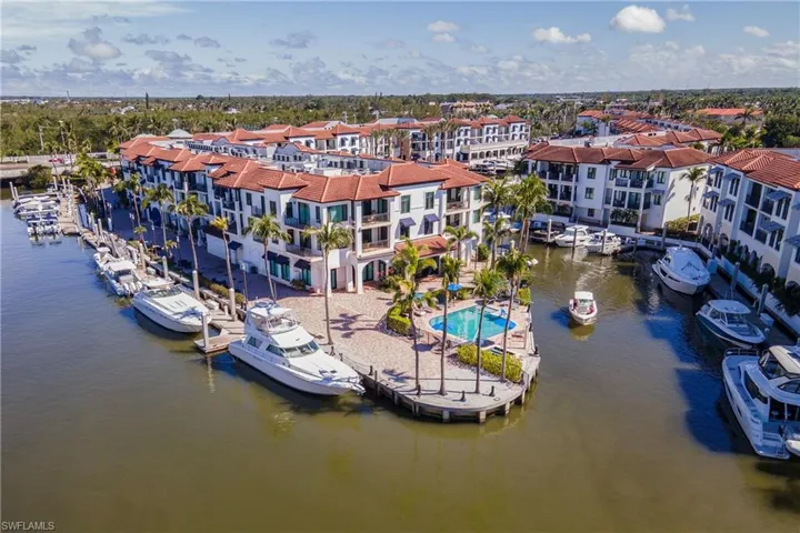 Aerial view of Naples Bay Resort Marina leading out to Naples Bay