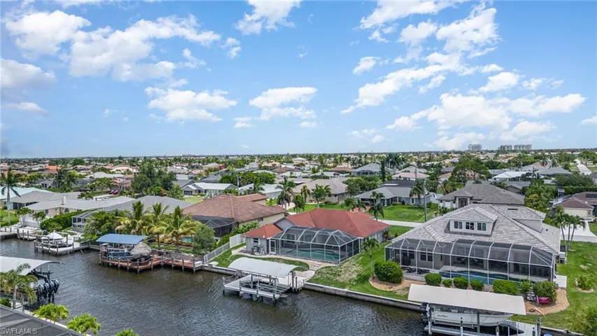 Aerial view of home featuring a water view