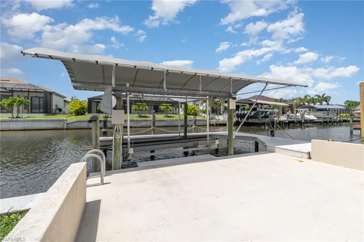 Concrete dock area with a canal water view