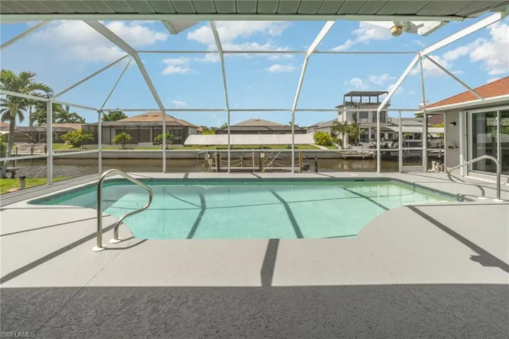 View of swimming pool, lanai area, boat dock area