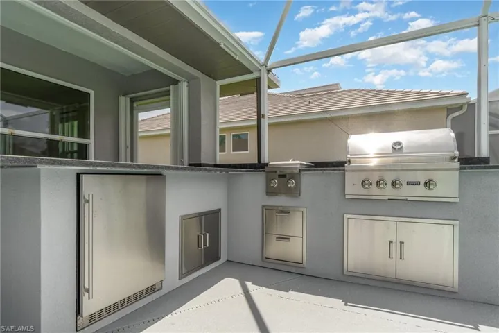 View of outdoor kitchen/bar/grilling area