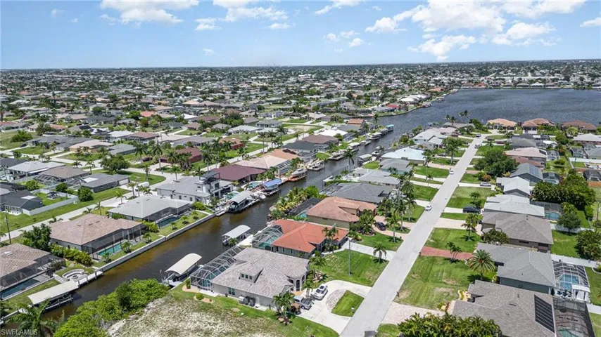 Aerial view featuring canal and home's proximity to Lake Finisterre water view